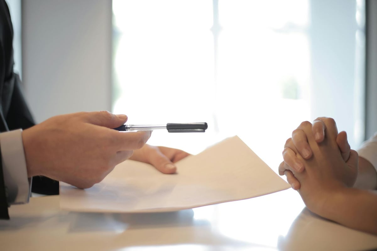 sales contract with a pen 